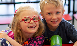 Two students smiling