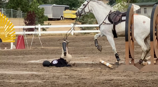 girl falling off horse